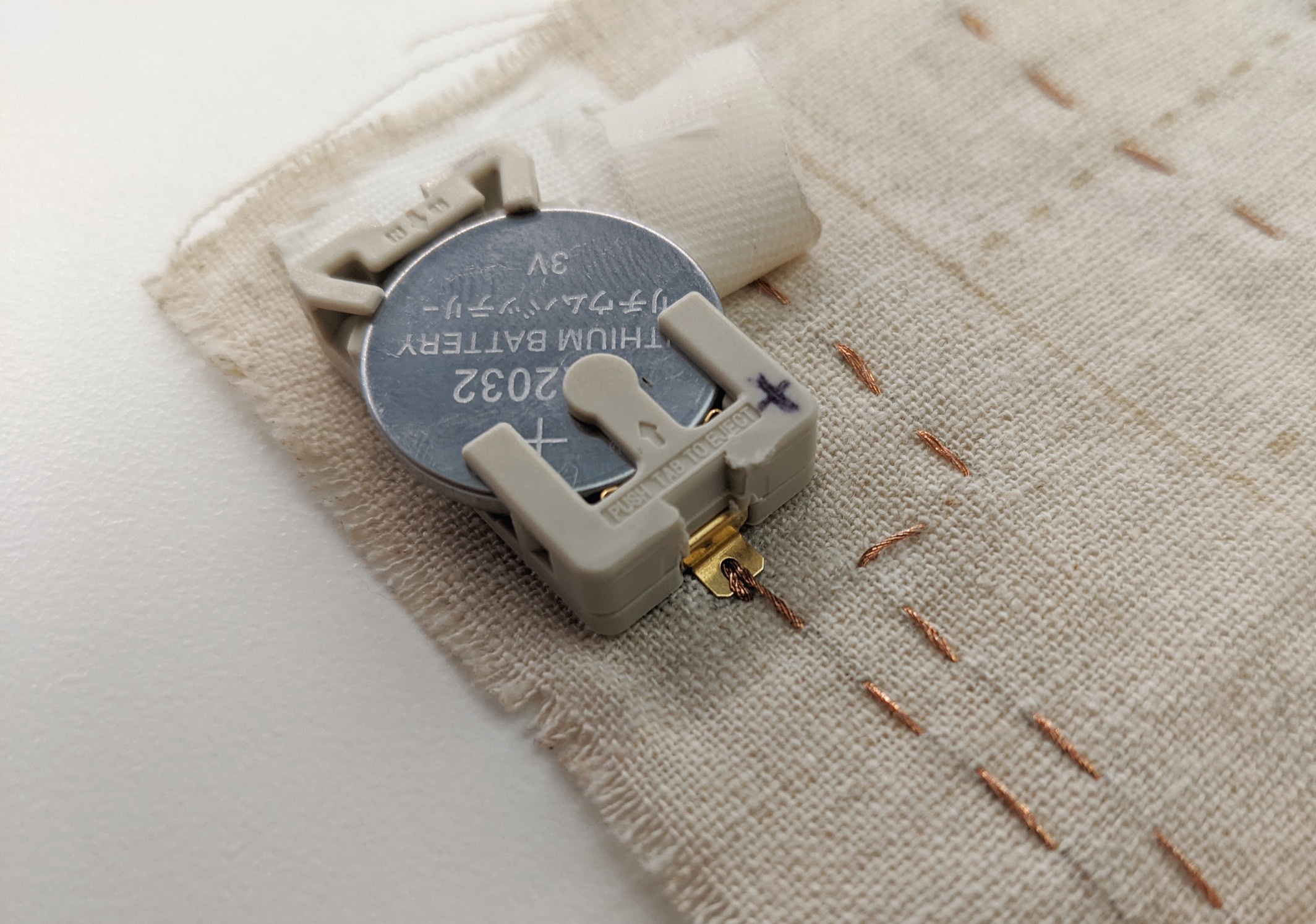 close up of coin cell battery holder